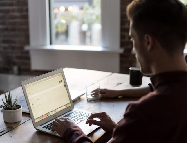 Mindful Wellbeing Man on computer